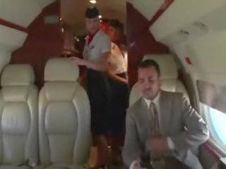 Oversexed stewardesses suck their clients hard kotak on the plane