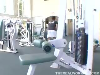 Busty tattoed milf swallowing cum in the gym